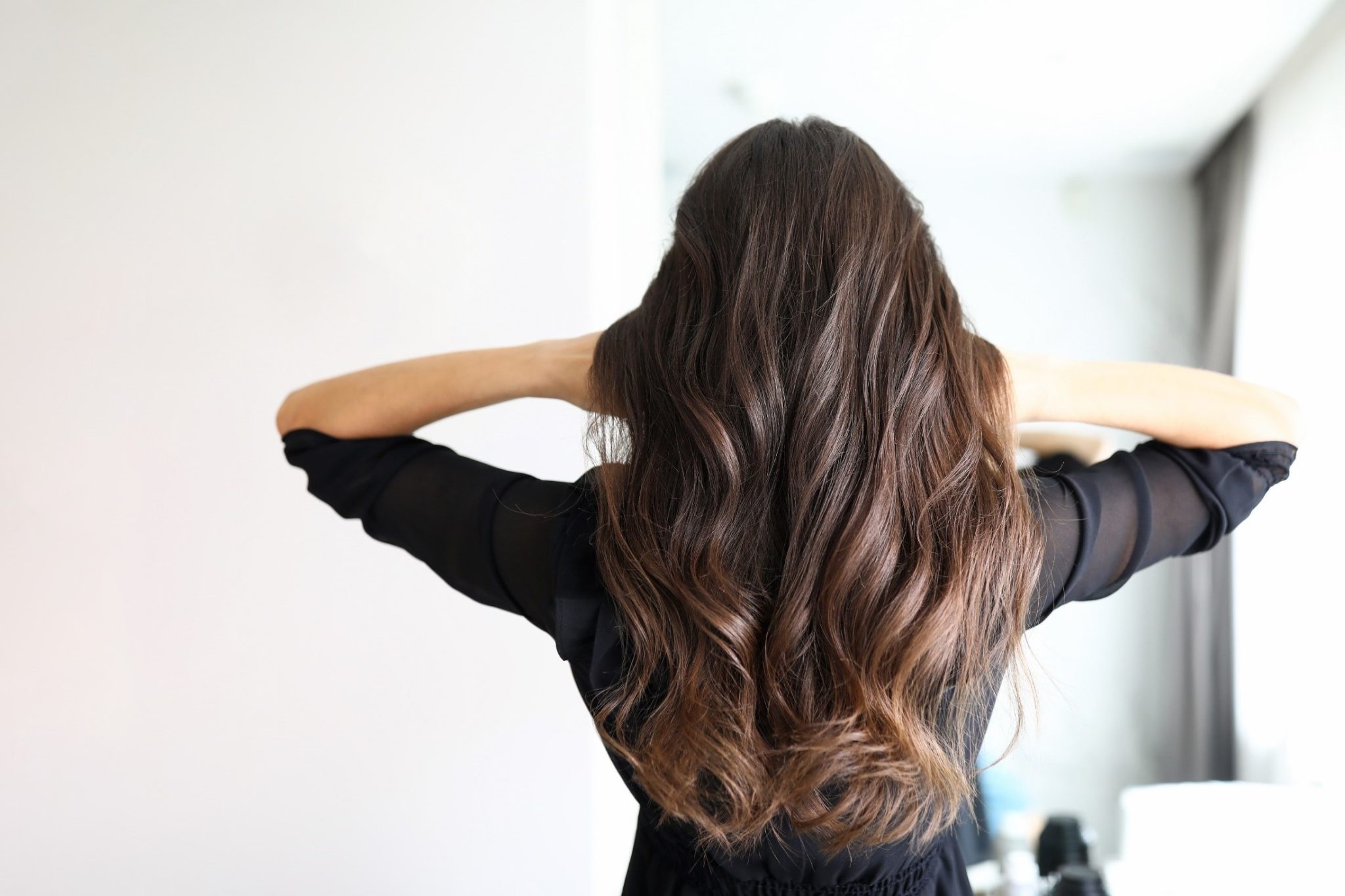 Lady demonstrating new hair styling